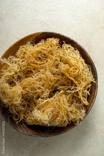 Fototapeta Golden dried Sea Moss, healthy food supplement rich in minerals and vitamins use