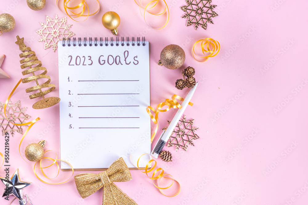 Notebook with New's Year Resolutions massage, with Christmas ornaments