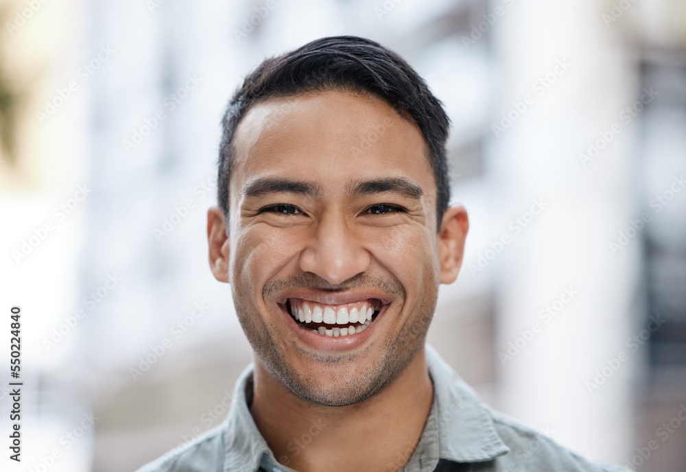Happy, smile and face portrait of a man with a vision, mindset and motivation for success. Young entrepreneur or corporate professional businessman smiling in happiness over city street background. Happy, smile and face portrait of a man with a vision, mindset and motivation for success. Young entrepreneur or corporate professional businessman smiling in happiness over city street background.