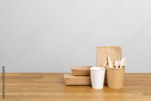 Fototapeta Naklejka Na Ścianę i Meble -  Eco friendly food packaging. Paper recycling zero waste natural products. A box of paper for food disposable catering of nature and recycling concept. Plastic free set on background.