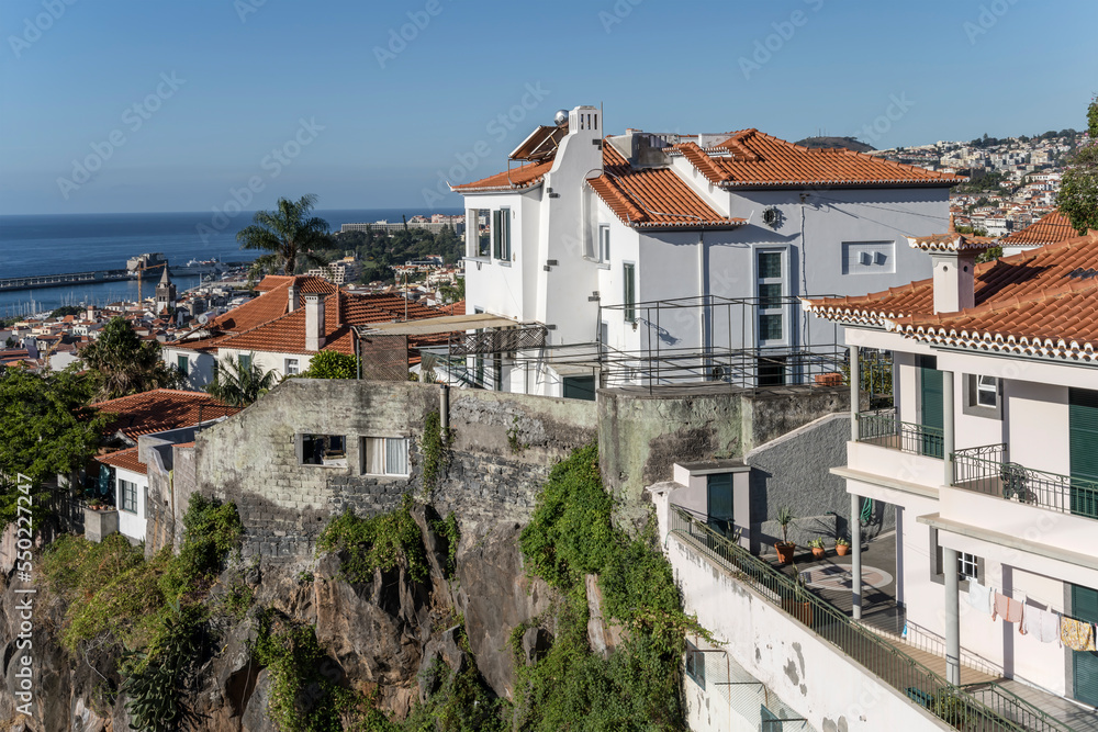 aerial cityscape of historical town with houses on steep cliff, Funchal, Madeira