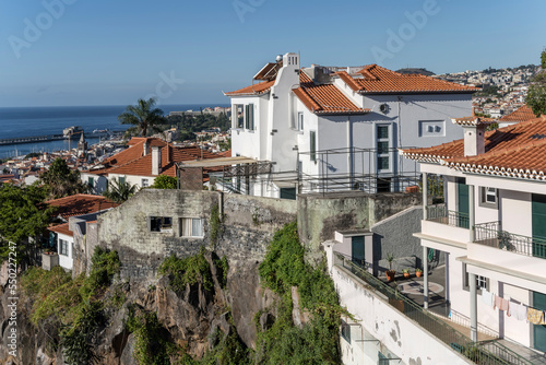 aerial cityscape of historical town with houses on steep cliff, Funchal, Madeira