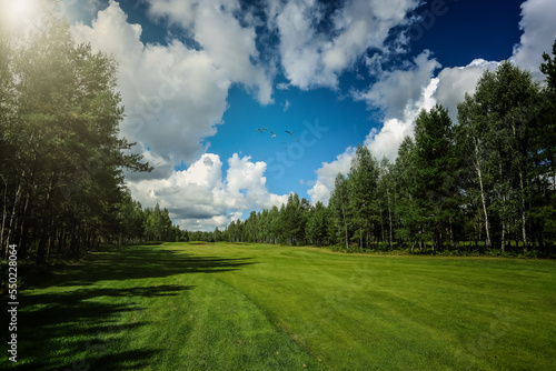 Panorama view of Golf Course with fairway field. Golf course with a rich green turf beautiful scenery.