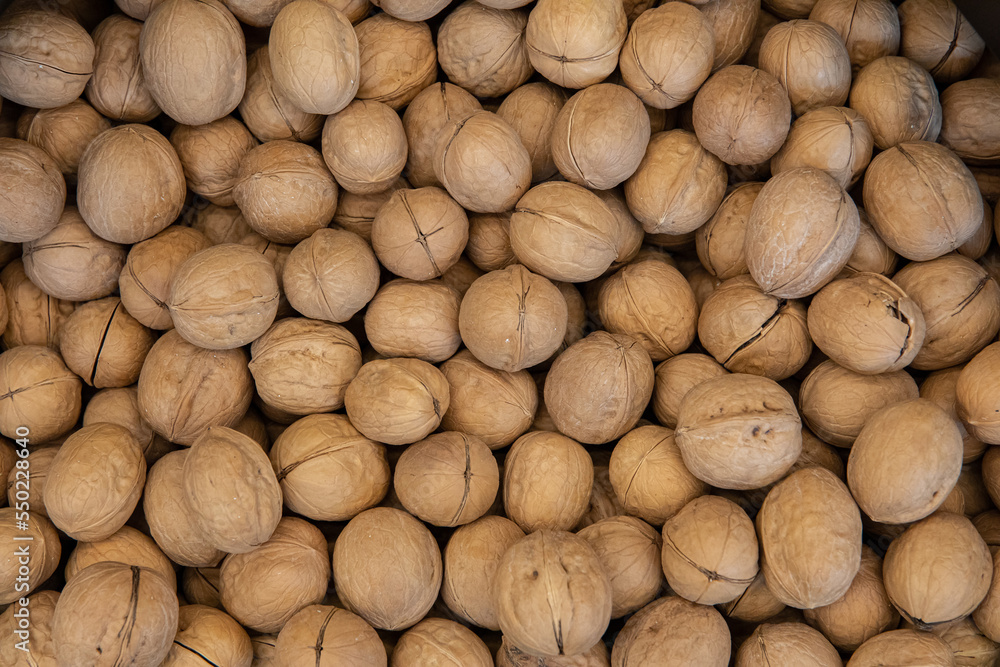 Natural organic walnut background pattern or texture Natural organic walnut background pattern or texture