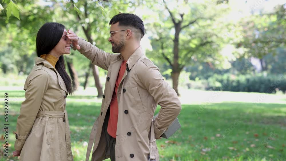Caucasian boyfriend give box gift to lovely pretty girlfriend in autumn park surprise present for valentine's day birthday anniversary symbol of love affection Caucasian boyfriend give box gift to lovely pretty girlfriend in autumn park surprise present for valentine's day birthday anniversary symbol of love affection