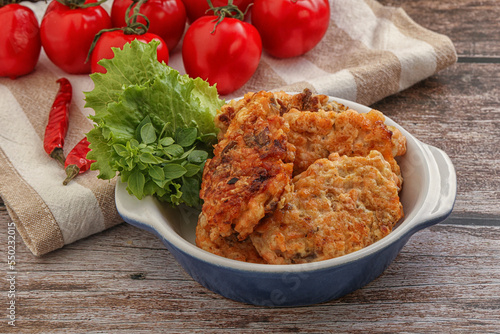 Fried salmonn cutlet in the bowl