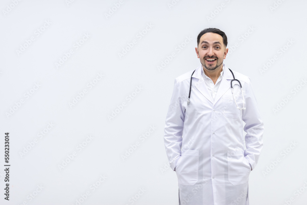 Photo of male mature doctor posing at camera with a stethoscope. Photo of male mature doctor posing at camera with a stethoscope.