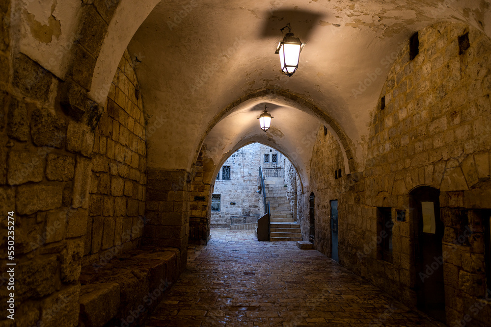 Ancient stone pedestrian arched tunnel in Old City of Jerusalem, Israel.