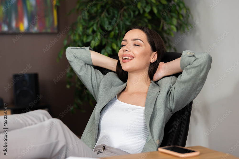 Close up shot attractive beautiful buisness woman at office home sitting in office chair relaxing after stressful hard day. Working process concept. Close up shot attractive beautiful buisness woman at office home sitting in office chair relaxing after stressful hard day. Working process concept.