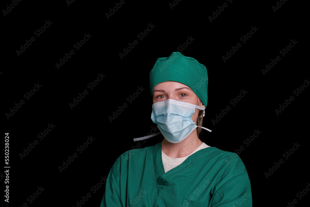 Doctor surgeon preparing makes an operation. Isolated on a black background. Doctor surgeon preparing makes an operation. Isolated on a black background.