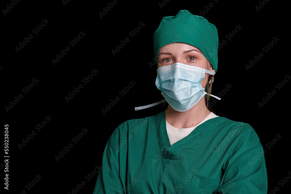 Doctor surgeon preparing makes an operation. Isolated on a black background. Doctor surgeon preparing makes an operation. Isolated on a black background.