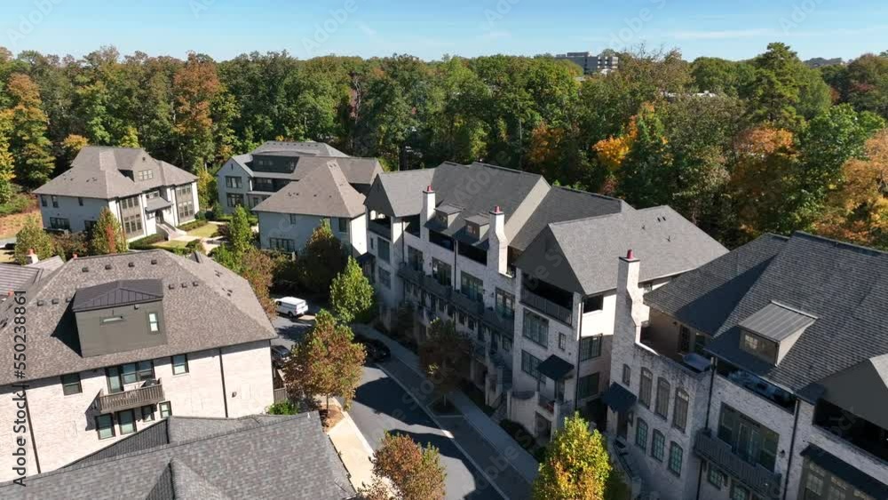 Modern new upscale apartment buildings in USA during autumn. Aerial establishing shot. Modern new upscale apartment buildings in USA during autumn. Aerial establishing shot.