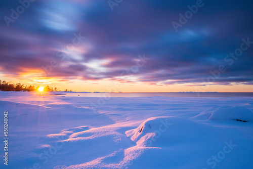 Sunset over the frozen sea. Fäboda, Finland