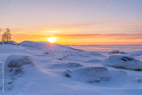 Sunset over the frozen sea. P  rken  s  Finland