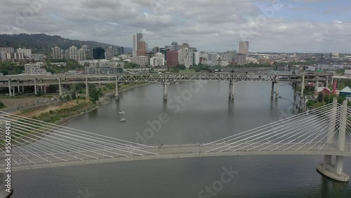 Drone view of Tilikum Crossing over Willamette River, the Morrison Bridge and the riverplace Marina photo