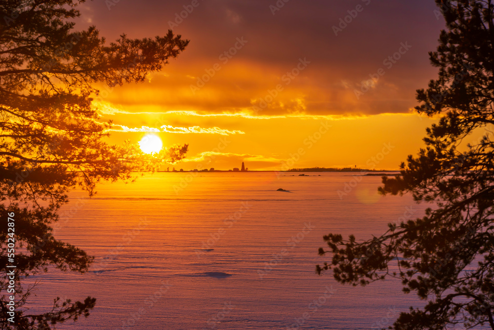 Dramatic winter sky at sunset. Pörkenäs, Finland