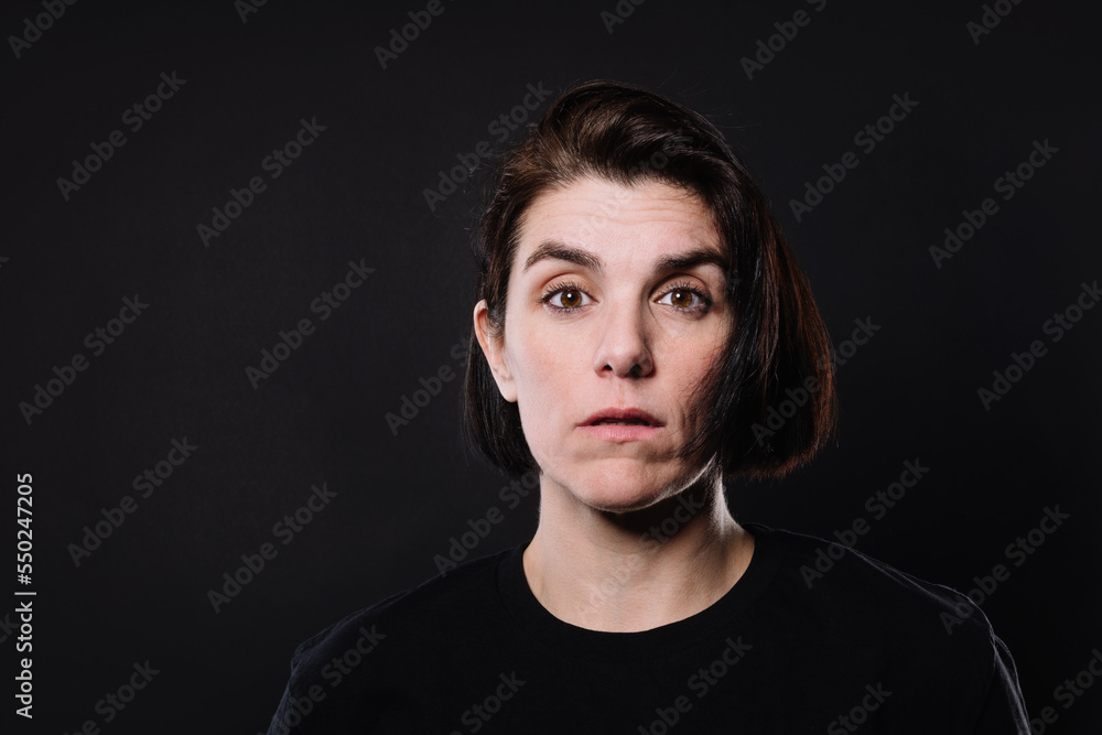portrait of a surprised woman looking into the camera portrait of a surprised woman looking into the camera