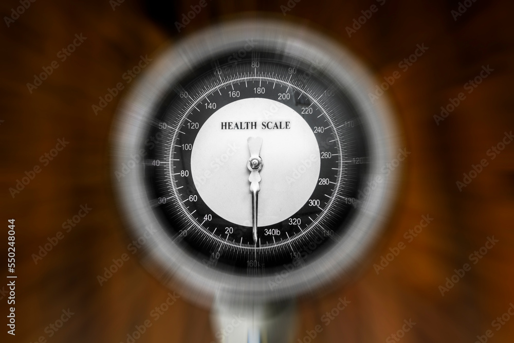 Zoom-blur effect of Weight Scale with wood background Zoom-blur effect of Weight Scale with wood background