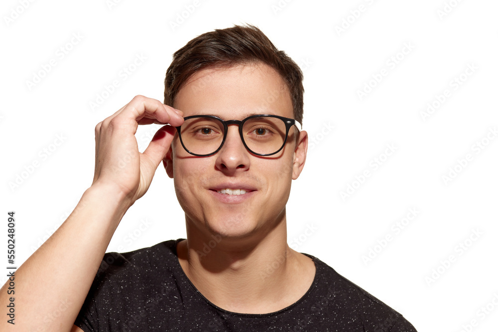 Close-up portrait of young handsome man wearing eyewear isolated on white studio background. Concept of men's health, beauty, self-care, body and skin care. Close-up portrait of young handsome man wearing eyewear isolated on white studio background. Concept of men's health, beauty, self-care, body and skin care.