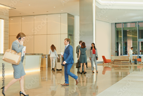 Business people, walking and an airport terminal for travel, global trade and success. Working, group and workers take steps though lobby with communication, check in and catch international flights.