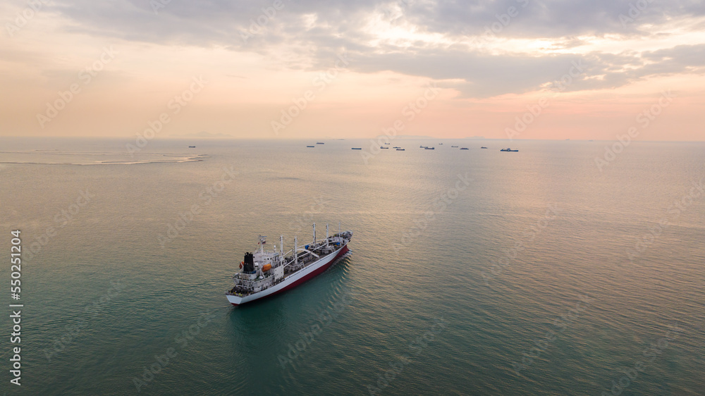 ship sailing in sea at evening sky aerial view