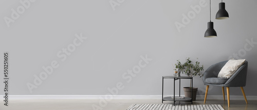 Interior of modern living room with armchair and table. Banner for design