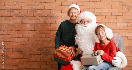 Santa Claus and cute little...