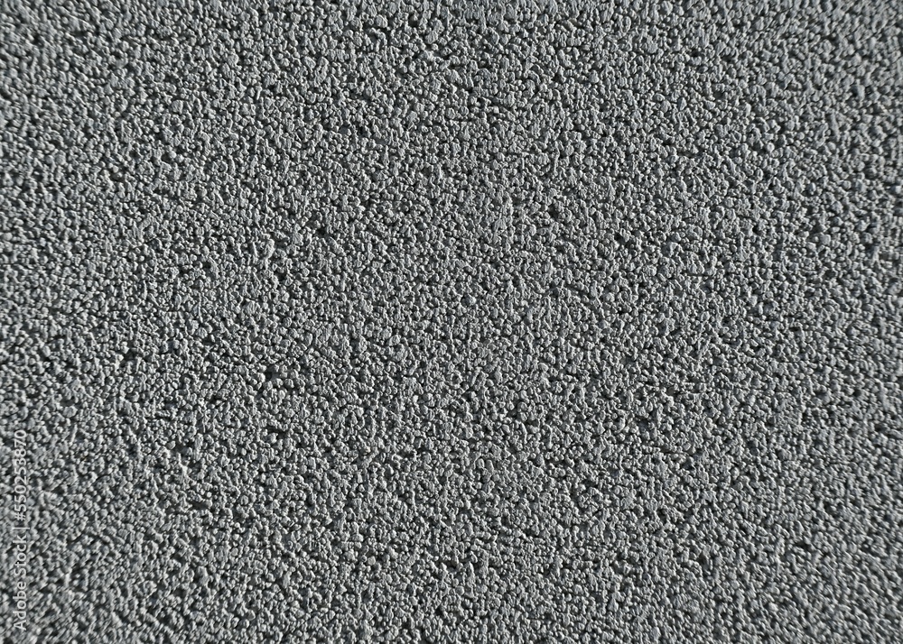 Fondo con detalle y textura de superficie de asfalto rugoso en tonos grises Fondo con detalle y textura de superficie de asfalto rugoso en tonos grises