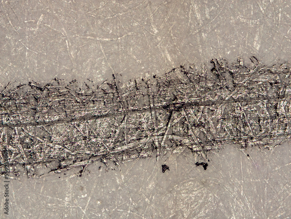 pencil stroke on a sheet of paper under the microscope with optical