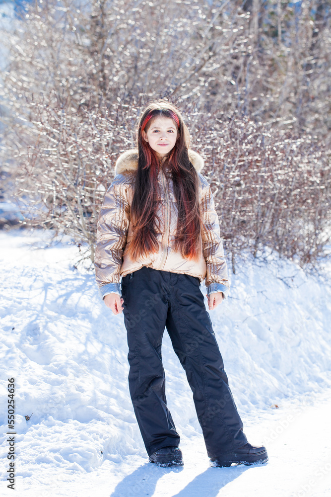 Little girl posing in winter park Little girl posing in winter park