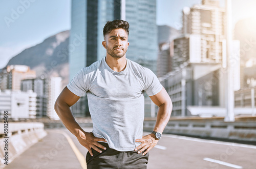 Serious sports man ready for fitness, workout and healthy exercise in urban city. Strong runner, thinking guy and determined athlete with motivation training for cardio run, marathon or jog outdoors