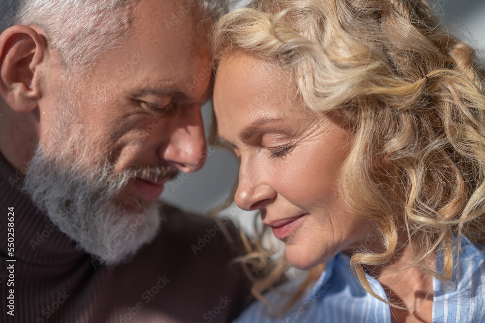 A mature couple looking in love and happy