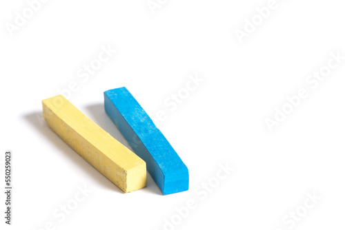 colored chalks on white background with peace message