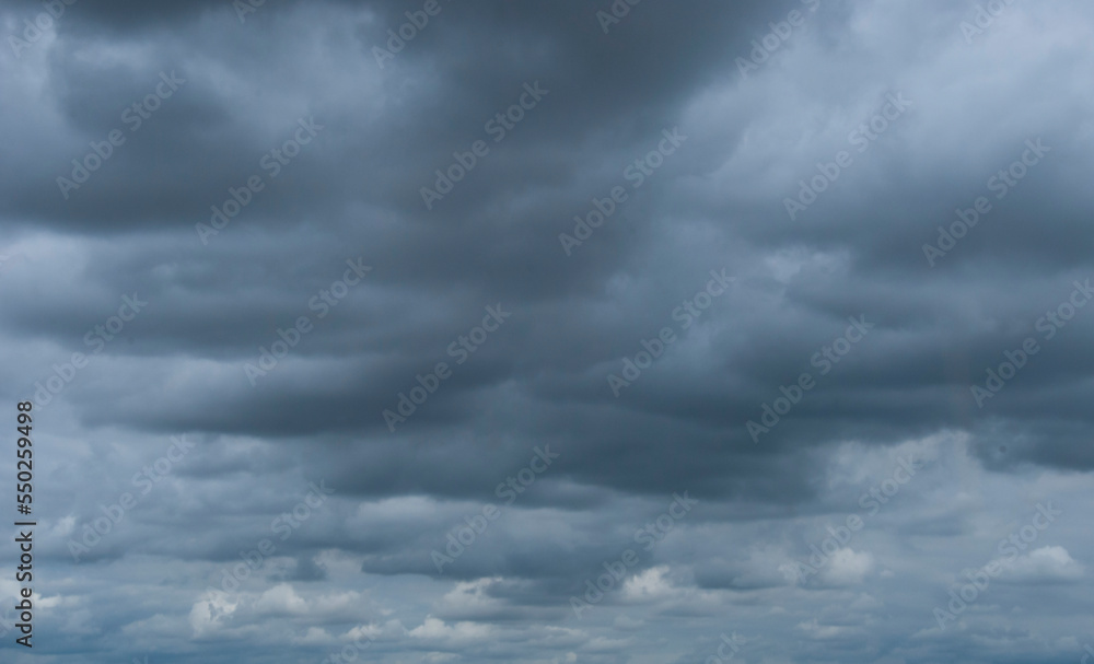 Turbulent grey clouds in daylight sky Turbulent grey clouds in daylight sky
