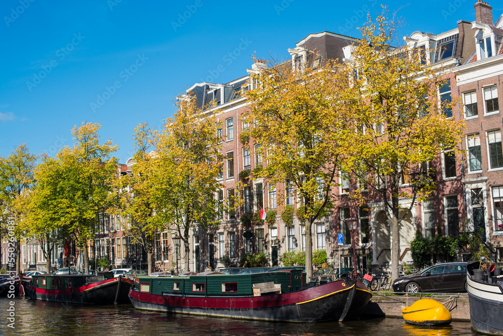 autumn and city canal houses in Amsterdam 