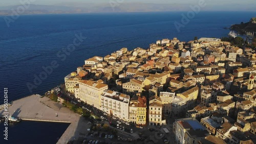 Kerkyra city, Corfu island, Greece, beautiful summer aerial drone view of Kerkyra old town center, with Ionean sea harbour port, Saint Spyridon Church, the Royal Palace and scenery beyond the city
 photo