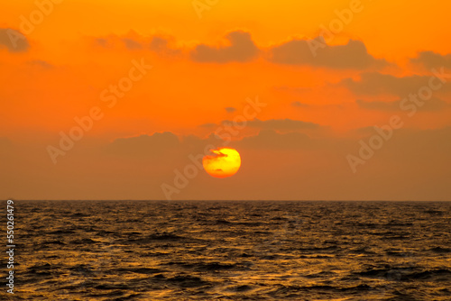Fototapeta Naklejka Na Ścianę i Meble -  Sunset On Ocean's Horizon
