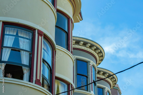 Row of circular building facades on house or home in the neighborhood or in a suburban area of the downtown city in shade