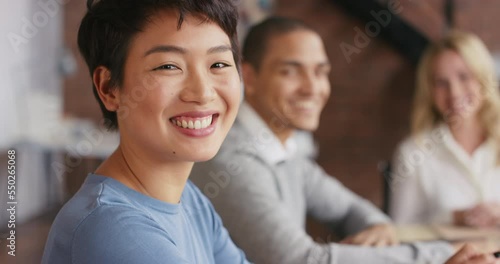 Asian woman, portrait and smile for team collaboration together for diversity business meeting or startup discussion in office. Teamwork, interracial creativity designers and happy planning stratergy photo