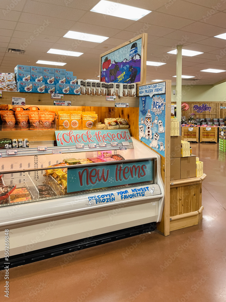 Freezer with new items sign inside Trader Joe's, an American