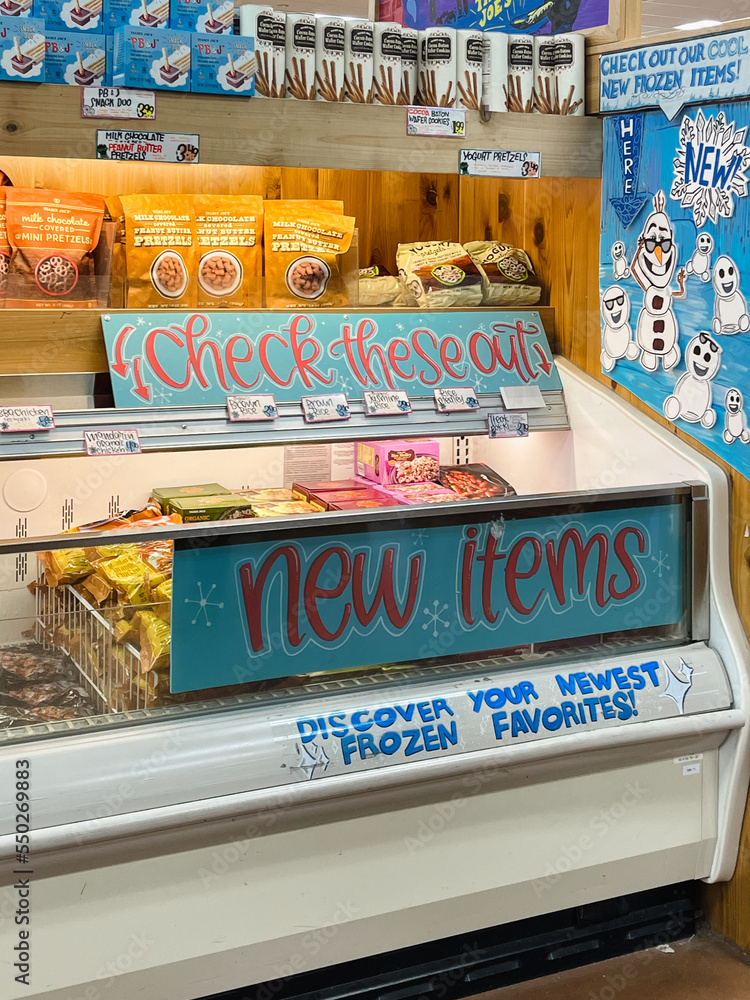 Freezer with new items sign inside Trader Joe's, an American
