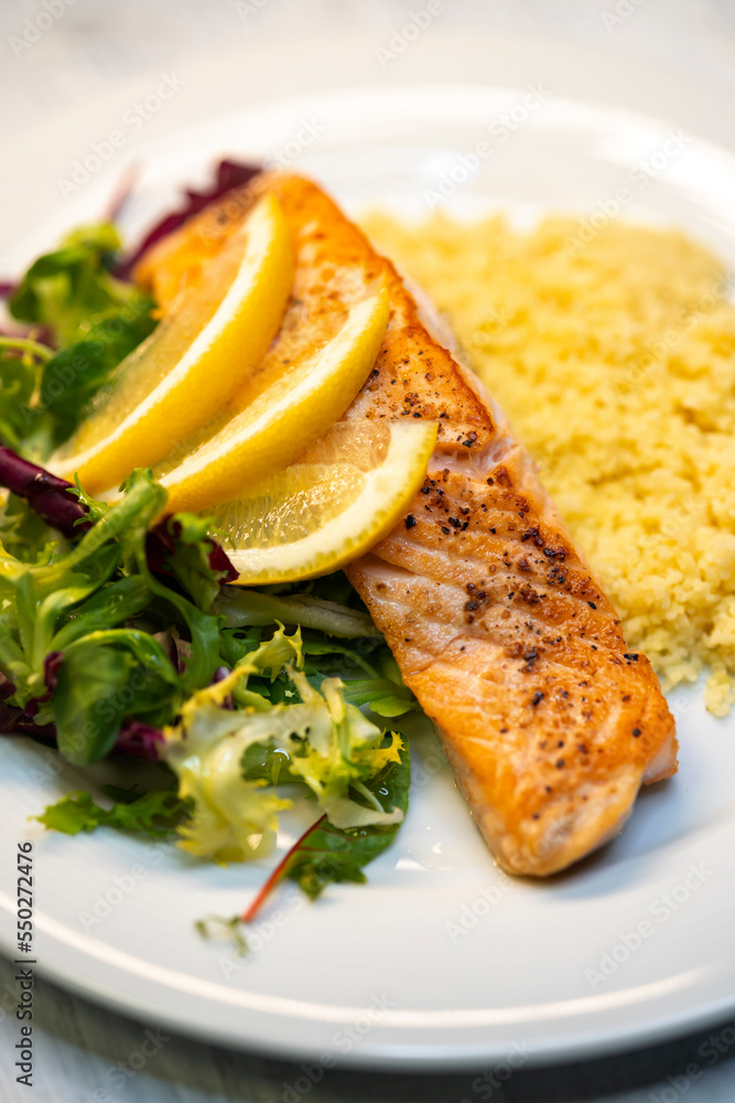 salmon fillet with couscous and vegetables salad salmon fillet with couscous and vegetables salad