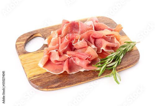 Foto Wooden board with slices of delicious ham and rosemary on white background
