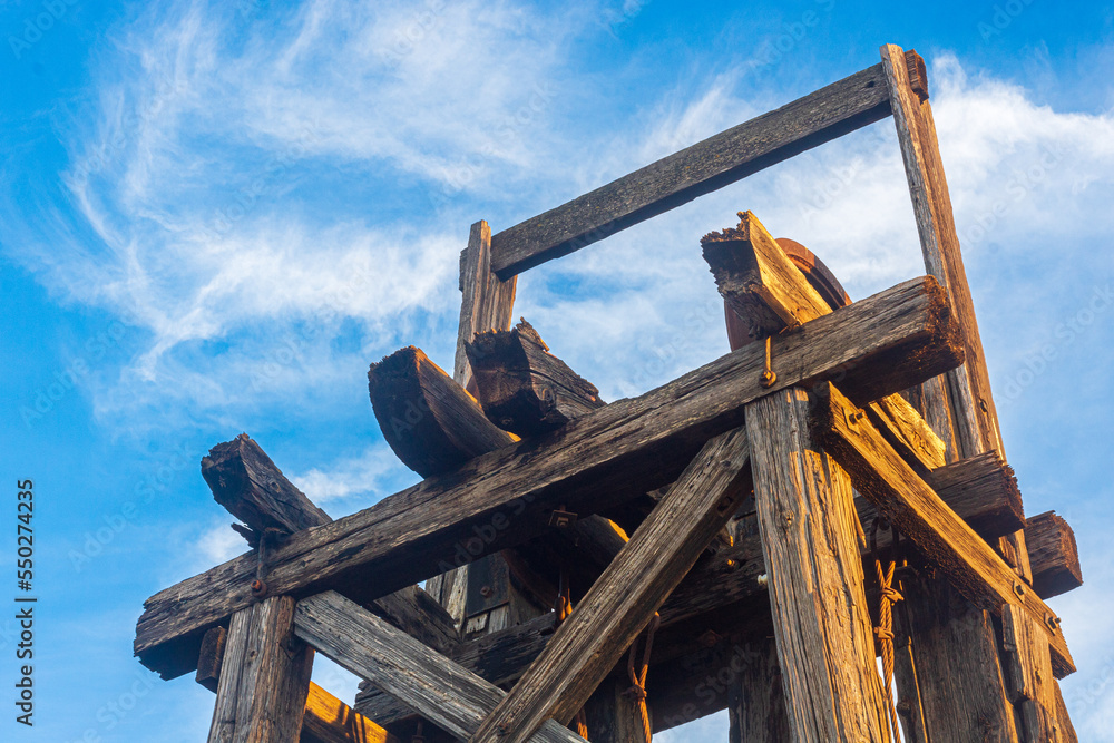 Close up of a wooden mine derrick made of large timber beams, Mazarron, Spain Close up of a wooden mine derrick made of large timber beams, Mazarron, Spain