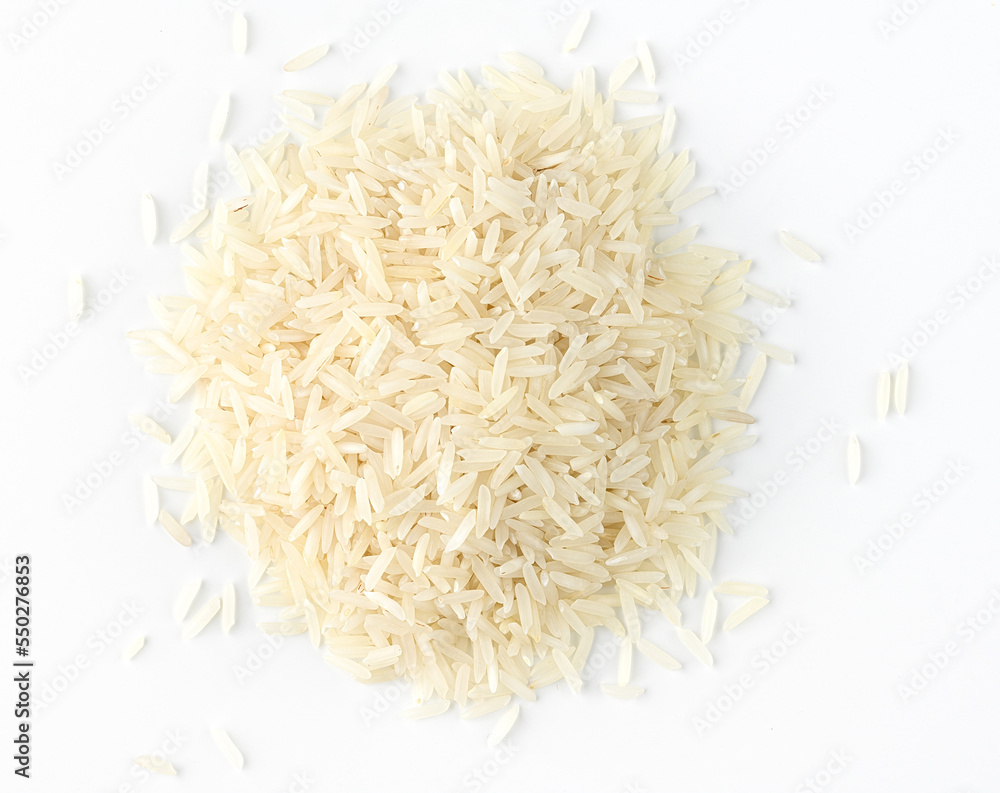 Dry white long rice basmati pile on a white background. Directry above Dry white long rice basmati pile on a white background. Directry above