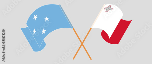 Crossed and waving flags of Micronesia and Malta