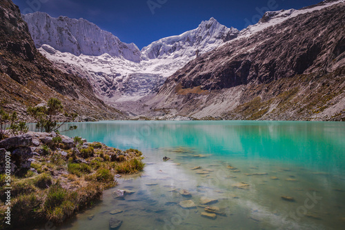 Llaca lake in Cordillera Blanca with snowcapped Andes, Ancash, Peru