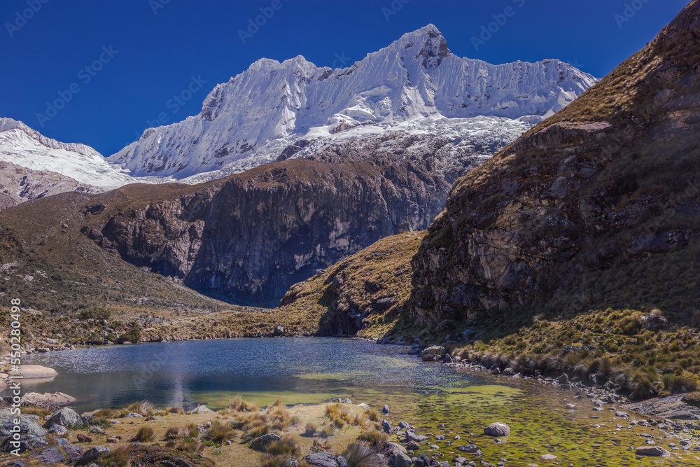 Secluded lake in Cordillera Blanca, snowcapped Andes, Ancash, Peru