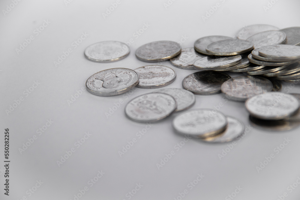 Coins used for payment in Thailand brought together and selective focus Coins used for payment in Thailand brought together and selective focus