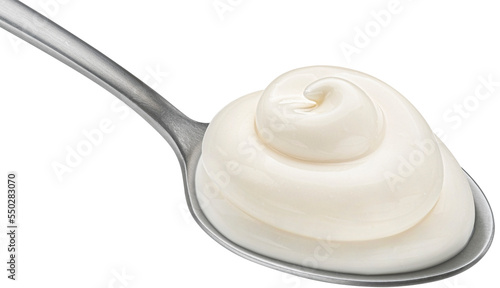 Yogurt in spoon isolated